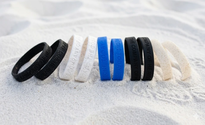Lot de 2 bracelets Company of Heaven et Help Someone Today en Silicone